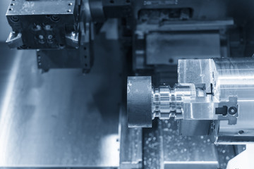 CNC lathe machine (Turning machine) cutting the metal  screw thread part  .Rotation of aluminium part.