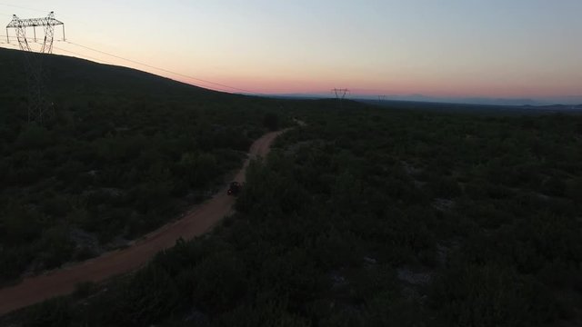 Drone shot of dune buggies driving offroad