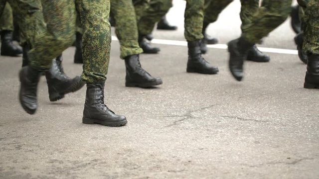 soldiers walking by the street