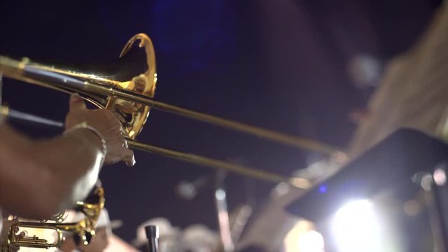 FEBRUARY 27, 2017 Mexico, Campeche. Carnival, dance and parade in colonial town ,street musician playing on instrument, close up trumpet in hands  from below