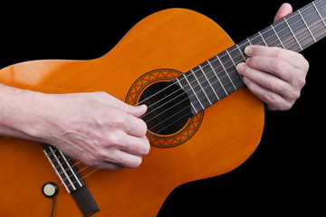 An elderly man with nervous hands plays a classic guitar retro music