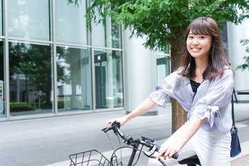 Business woman riding a bicycle