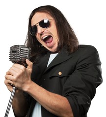 1980s rocker singing into a microphone