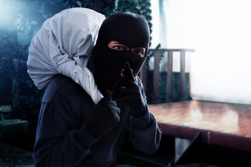 Masked thief stealing