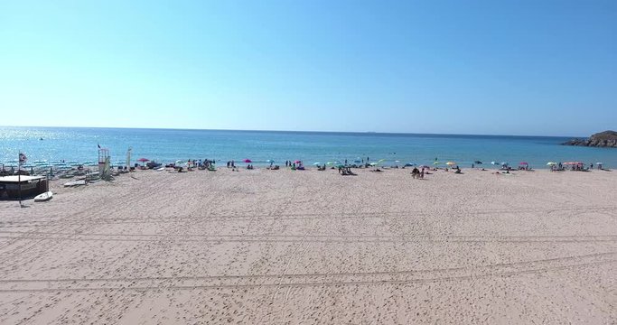 SARDINIA, ITALY  &ndash; JULY 2016 : Aerial shot over Chia Beach island on a beautiful day with sea and people in view