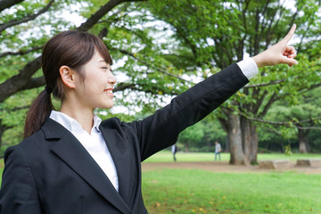 businesswoman pointing to something 