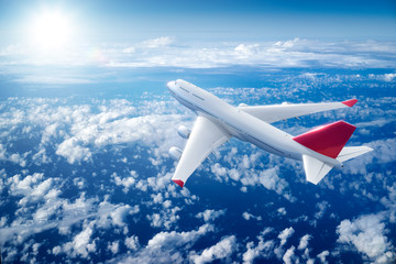 Airplane flying above clouds