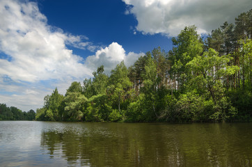 The lake is surrounded by trees along the banks
