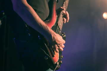 Closeup vintage toned photo of bass guitar