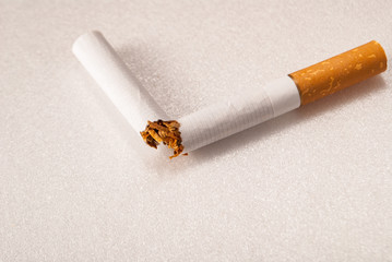 broken cigarette on white
