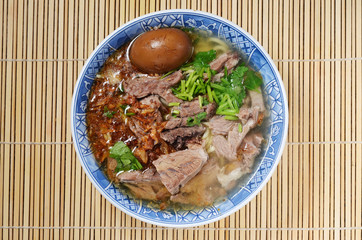 Top view of a bowl of soup noodles       