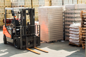 Forklift trucks for moving goods in warehouses.