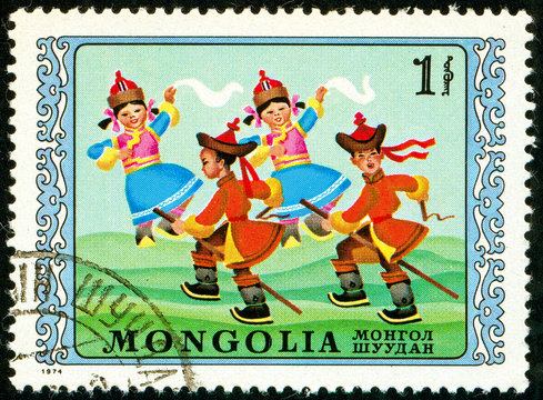 Ukraine - circa 2017: A postage stamp printed in Mongolia shows drawing Children dancing. Series: International Children's Day. Circa 1974.
