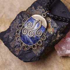 Stone bead necklace pendant on natural background