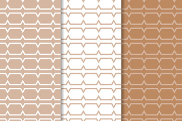 Naklejka premium Brown and white geometric ornaments. Set of seamless patterns