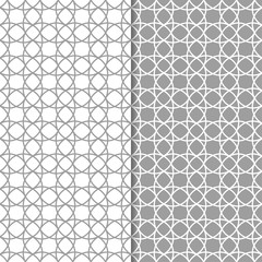 Gray and white geometric ornaments. Set of seamless patterns