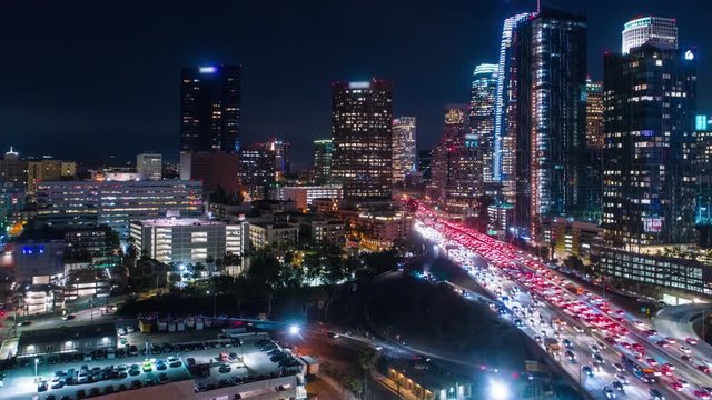 Cinematic urban aerial timelapse of downtown Los Angeles with city skyline and traffic