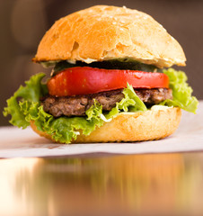 Large sandwich with tomato on the table