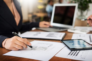 Administrator business man financial inspector and secretary making report, calculating balance. Internal Revenue Service checking document. Audit concept.