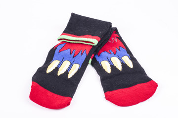 isolated pair of red socks with ornament on white background
