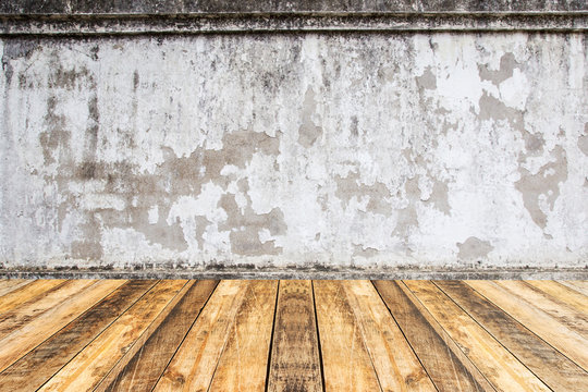 Empty perspective wood plank table top with old cement wall blackground