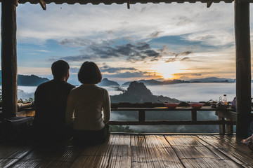 Couple watching the sunrise. at Baan Jabo