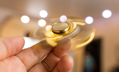 The golden spinner is spinning in his hand