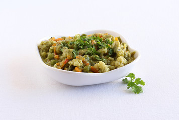 Cauliflower and peas curry, an Indian vegetarian food cauliflower and peas curry, is a side dish for food like chapati.