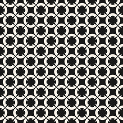 Black and white geometric ornament. Seamless pattern. Abstract monochrome texture with carved floral shapes, rounded grid, mesh, repeat tiles. Simple ornamental background. Design for decor, fabric