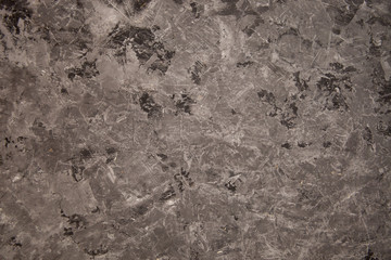 Textured gray background with imitation of concrete made of plaster.