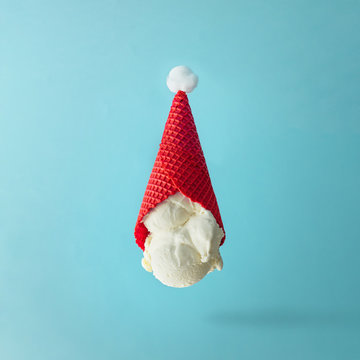 Santa Claus hat made of upside down vanilla ice cream. Christmas holiday minimal concept.