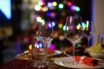 Festive table / Glasses on a festive background / Bokeh