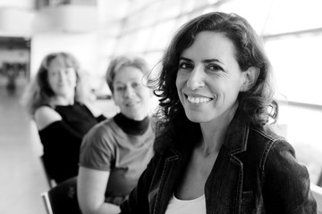 Indoor portrait of three beautiful 40 years old woman