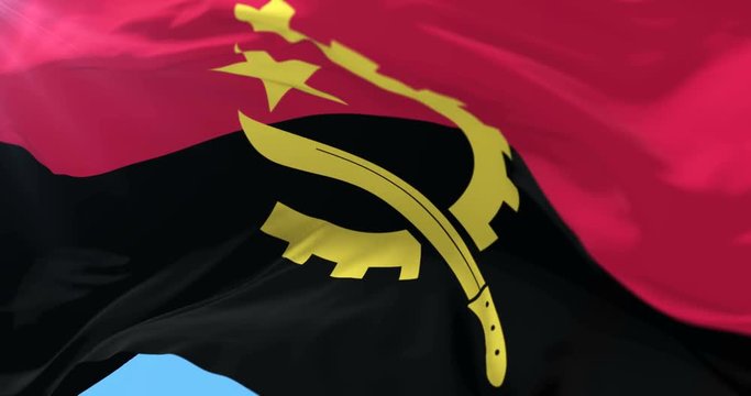 Angolan flag waving at wind in slow with blue sky, loop