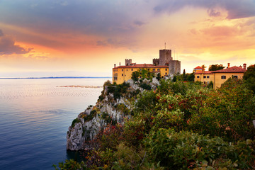 Amazing sunset over Mediterranean Duino Castle - obrazy, fototapety, plakaty