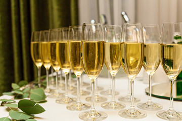 Close-up the glasses of the champagne on a table