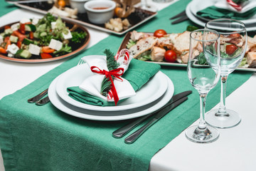 Served New Year or Christmas table closeup. Luxury restaurant