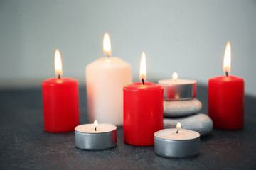 Obraz na płótnie Canvas Composition with burning candles on table