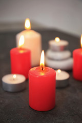 Fototapeta na wymiar Burning candles on table