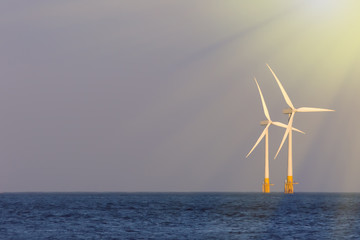Soft seascape. Wind, sea and solar power renewable energy represented by offshore wind turbines...
