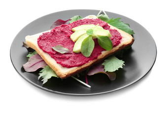 Plate with tasty toast, beet paste and avocado, isolated on white