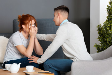 Male psychologist with client in office