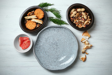 Set of dishware with ingredients on table