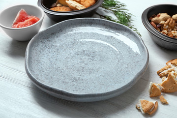 Set of dishware with ingredients on table