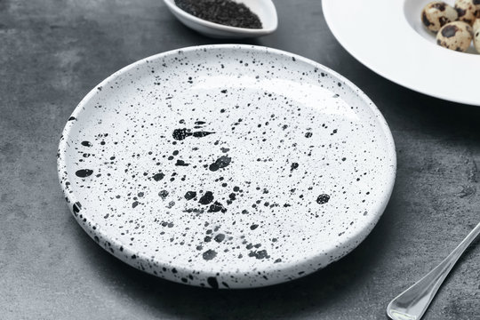 Ceramic plate on grey background