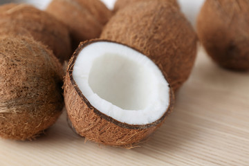 Pile of ripe coconuts on wooden background