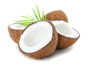 Halves of coconut on white background