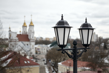 Fototapeta na wymiar Old Lantern Over an Old European City