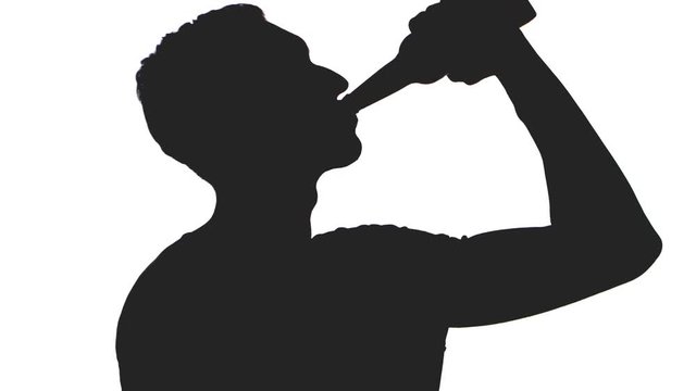 silhouette of a young man drinking beer from a bottle isolated on white background