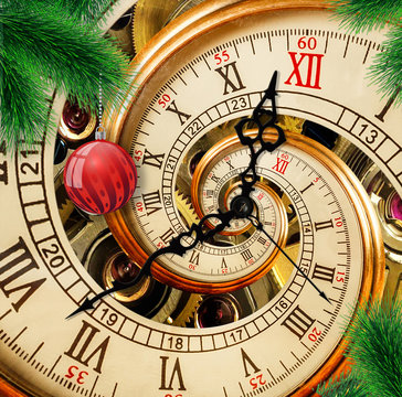 Abstract New Year clock with red ornament ball on green Christmas tree background. Its Christmas time. Happy New Year 2018 card postcard Merry Christmas antique old clock abstract fractal spiral swirl